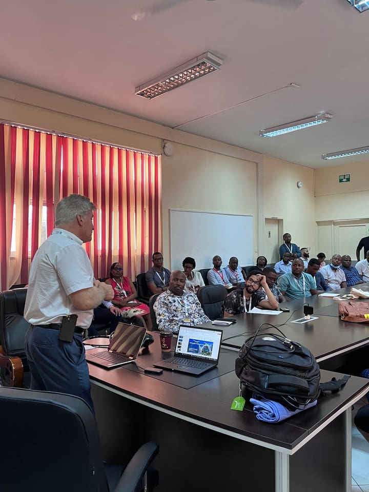 A presenter speaking with seated workshop participants